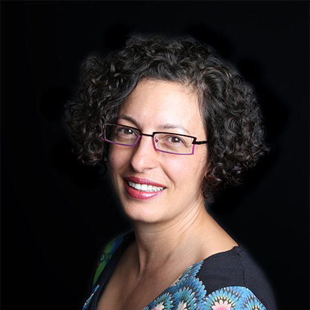 Mona Loutfy, seen from the shoulders up, wearing glasses and short black curly hair